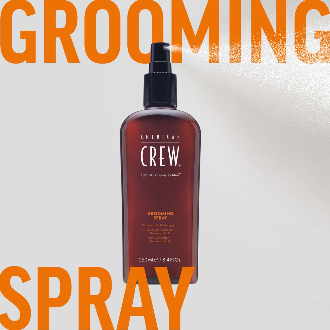 American Crew Grooming Spray clear hairspray being dispensed in background. Text on graphic states "Grooming Spray". 