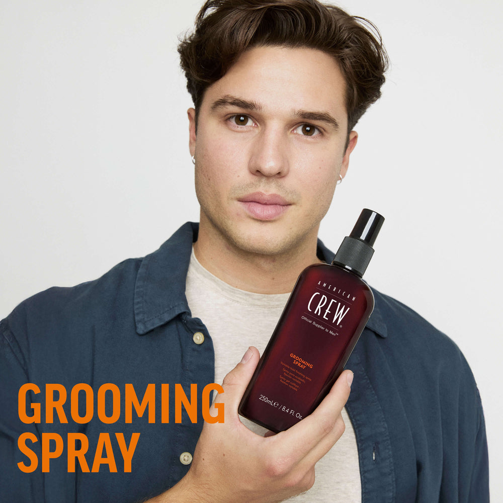 Finished Beauty Image. Dragan Mikulic Moragues holding Grooming Spray by American Crew