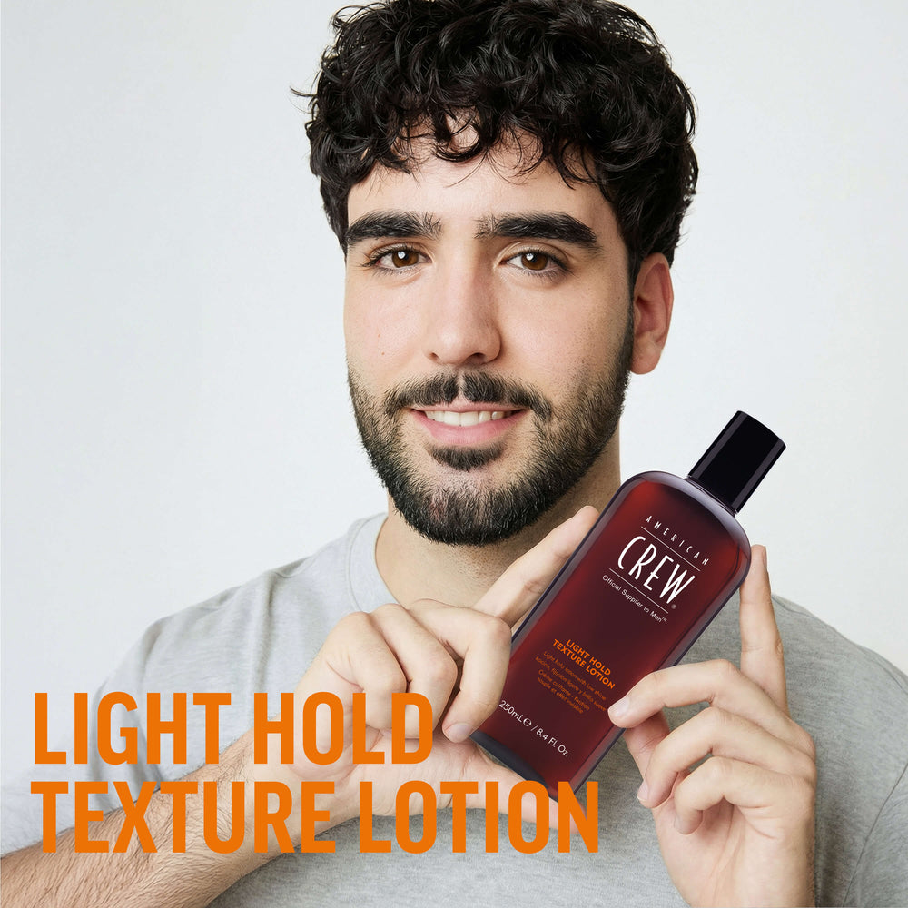 Finished Beauty Image. Diego Serrano Rosado holding Light Hold Texture Lotion by American Crew