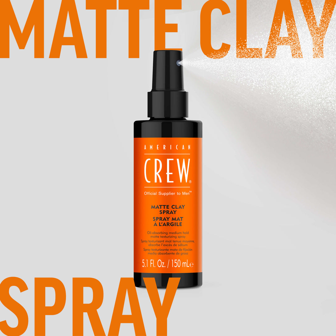American Crew Matte Clay Spray clear hairspray being dispensed in background. Text on graphic states "Matte Clay Spray". 