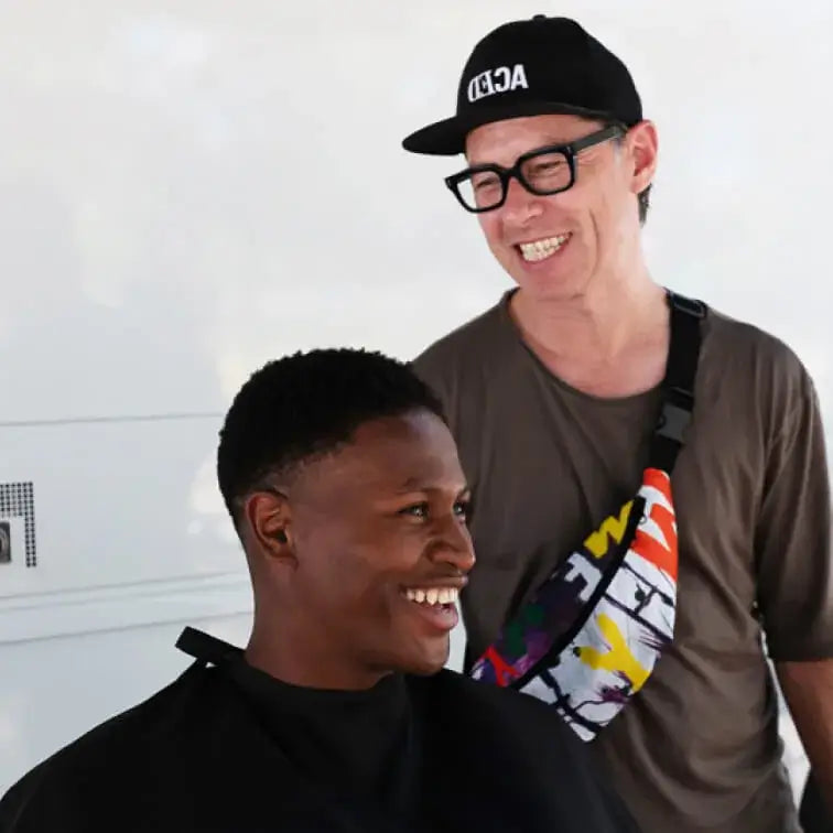 American Crew Global Educator Paul Wilson Styles Hair of Laughing Black Model