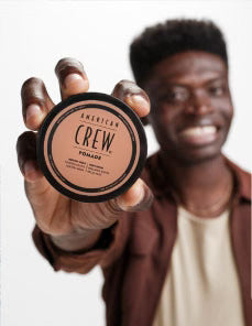 Model holding Pomade Puck